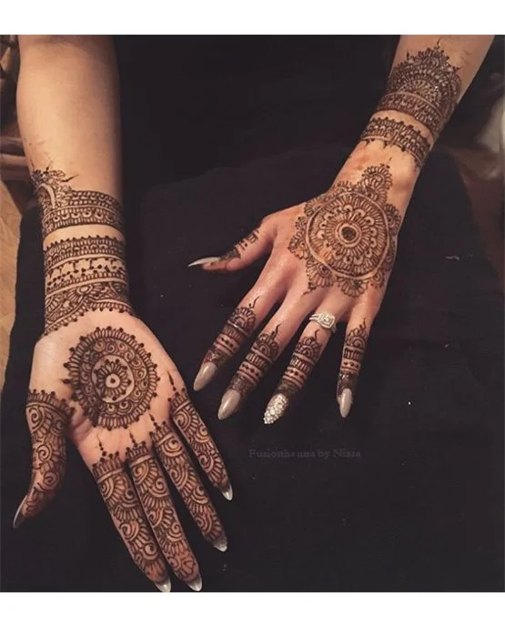 Ornate Pendant And Spiral Featuring Simple Full Hand Mehndi Design